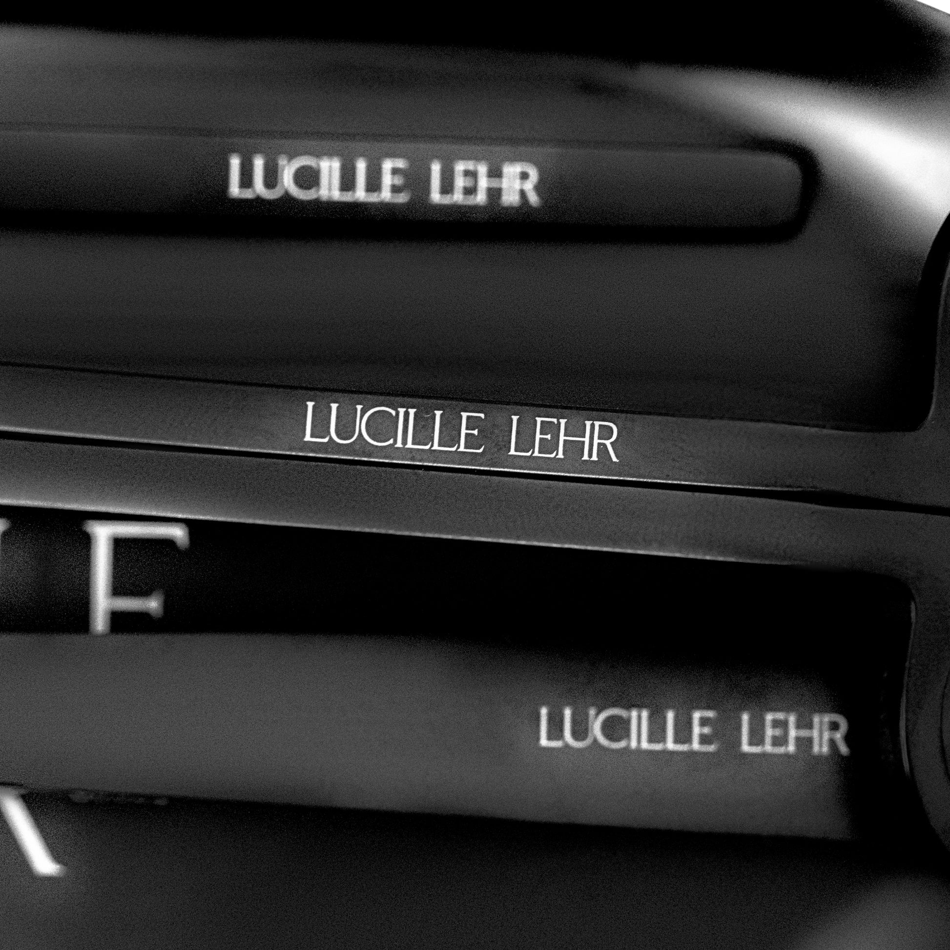 Close-up of Lucille Lehr Branding on Candle Care Tools: A detailed view showcasing the elegant Lucille Lehr logo engraved on sleek black candle care tools. This high-quality finish adds a touch of luxury and sophistication to your candle care routine.