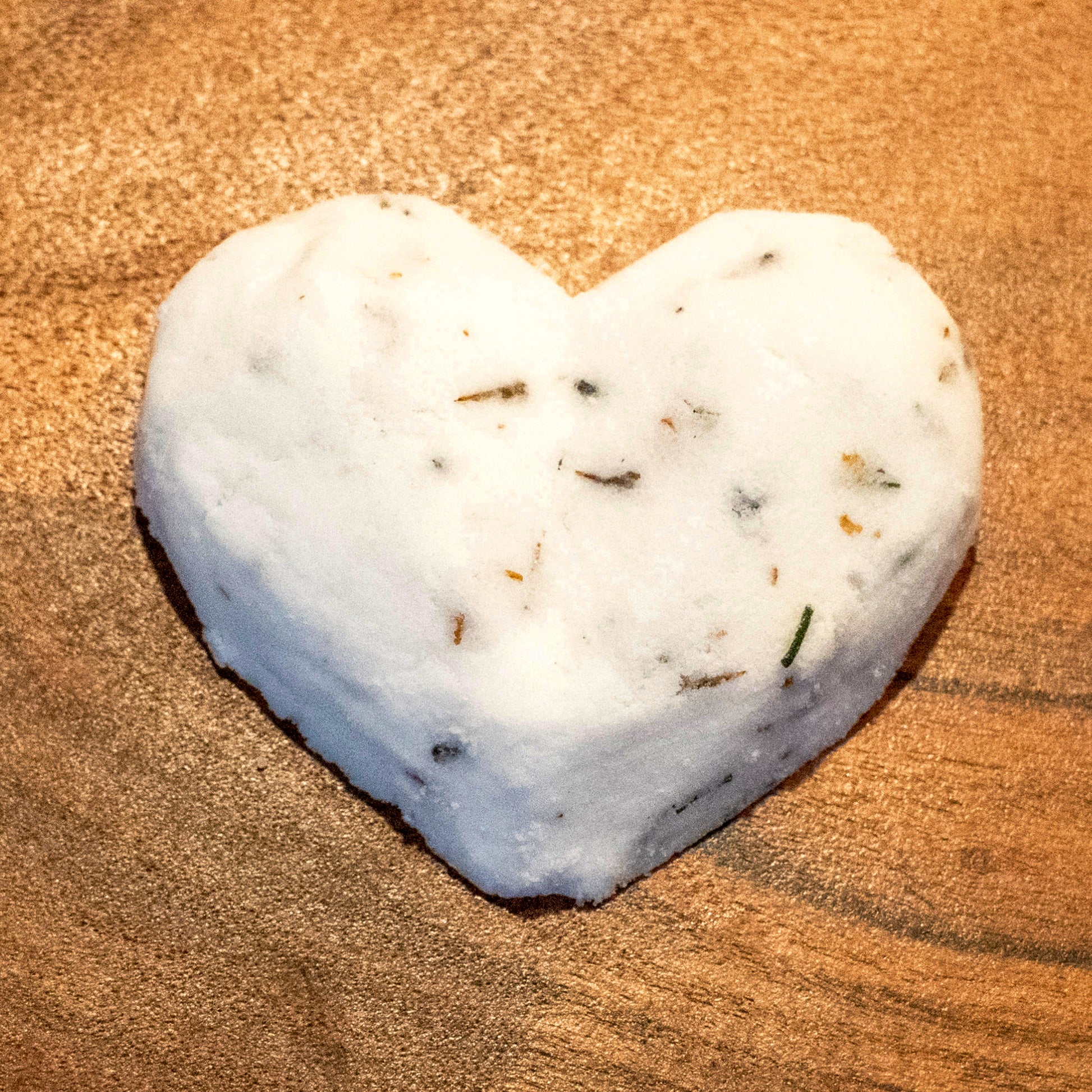 ucille Lehr's Heart-Shaped Lavender Rose Bath Bomb: Indulge in a relaxing bath with this handcrafted, heart-shaped bath bomb, infused with calming lavender and rose essence.